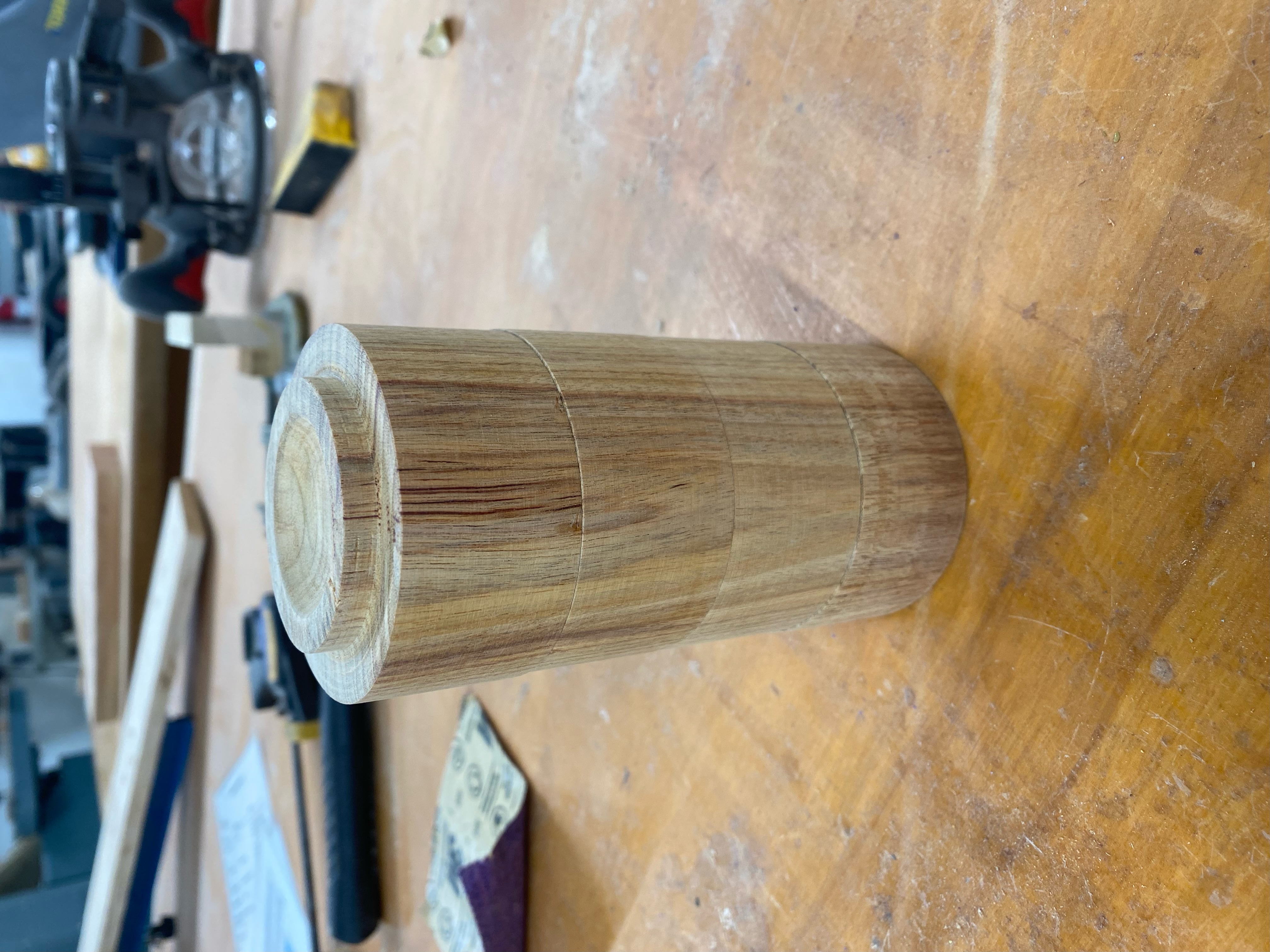 When stacked, the wood grain continues between the bowls